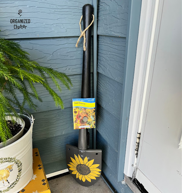 Photo of an upcycled sunflower themed camp shovel