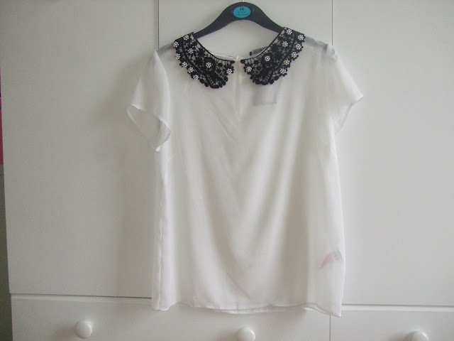 white sheer blouse with black lace collar