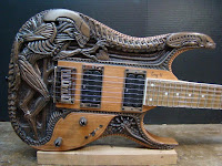 http://guitarnoize.com/carved-alien-guitar/