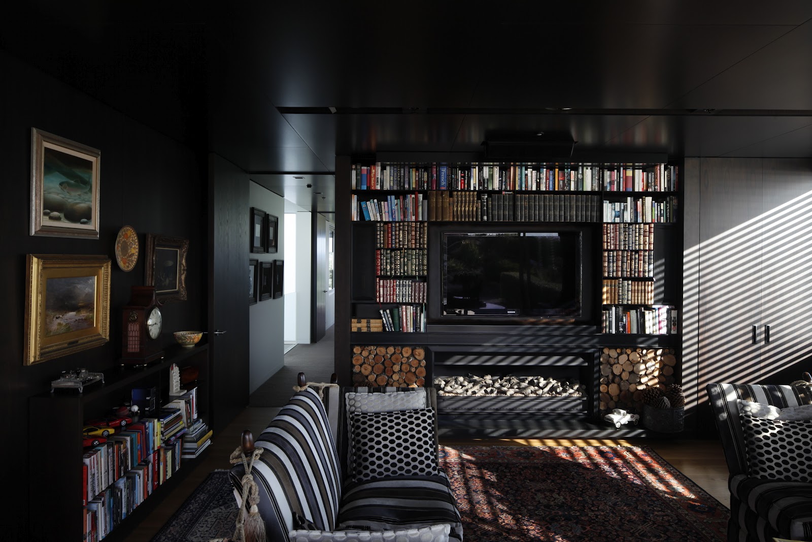 Upstairs A Dark Painted Library Located Behind The Main Bedroom Makes