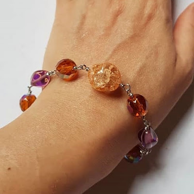 Wire Wrapped Fire Polished Glass Beads Bracelet on Shuku's Wrist