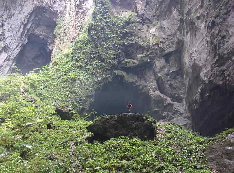 Massive cave with a person to compare size
