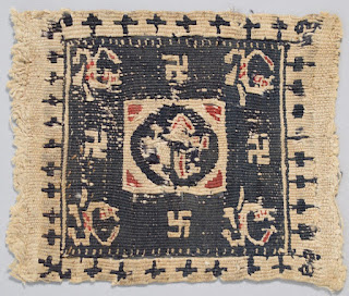 Egyptian cloth with swastikas and other designs.