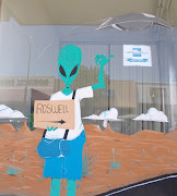 . alien stuff, particularly around the museum. This mural was on a window .