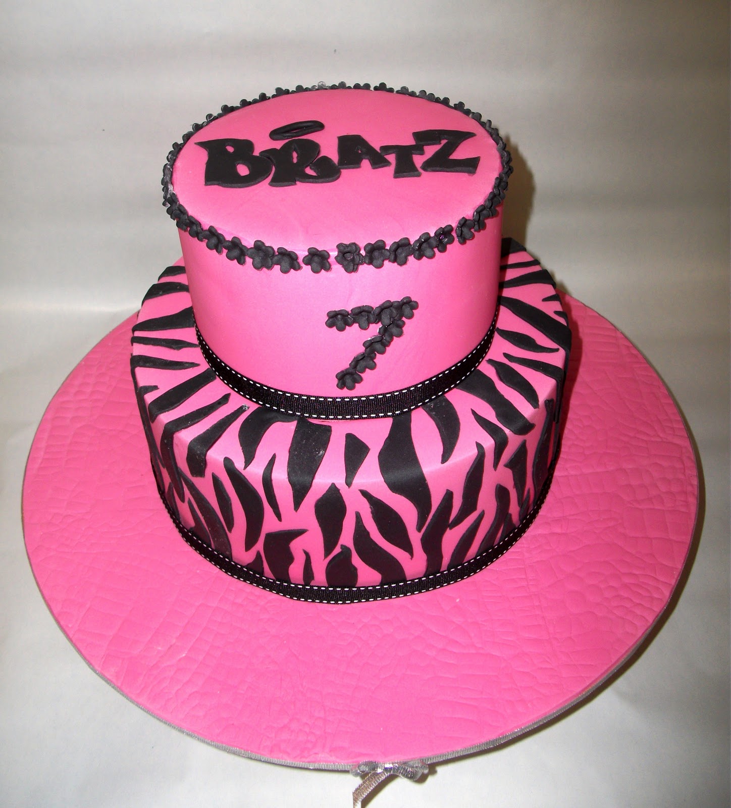 hot pink wedding cake cake with a hand cut bratz logo topping the cake a huge hit with the 