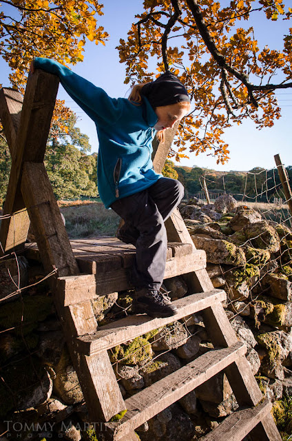 Kids playing in autumn woods, shot by Tommy Martin, for Sprayway