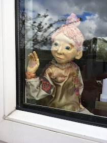 Poilin Puppet looking out the window  - Corina Duyn Puppets