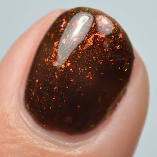 black jelly nail polish with color shifting flakies