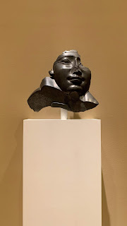 Face and Shoulder from an Anthropoid Sarcophagus, 332–30 B.C.E. Black basalt. Brookly Museum