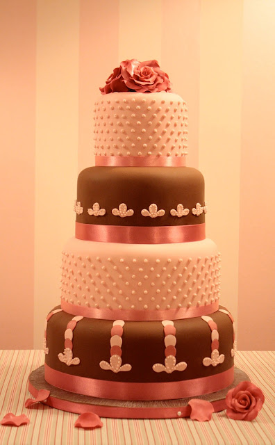 two-tone-wedding-cake-with-coral-ribbon-and-roses-topper
