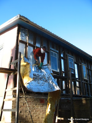  Click up on the scaffolding with insulation and a 'bandit' mask.