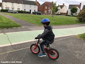 Child learning to ride a bike