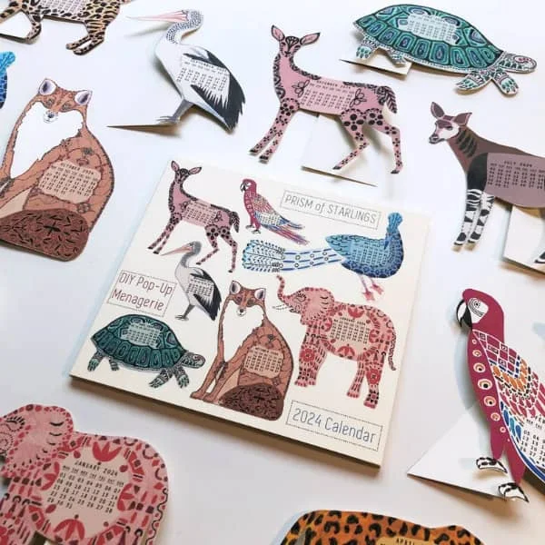 pop-up paper animal images with a monthly calendar printed on each animal