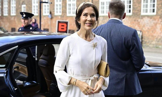 Crown Princess Mary wore a light crepe wool wrap coat by Australian luxury designer Kitx. Gianvito Rossi Ellipsis nude python pumps