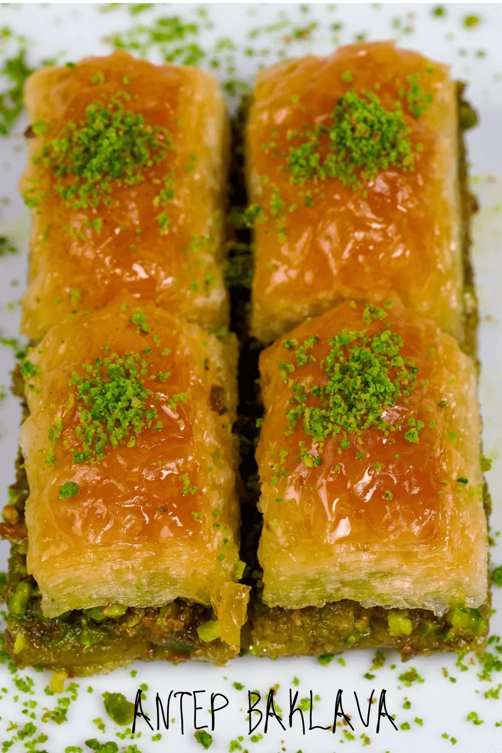Six equal pieces of unabi baklava garnished with green pistachios