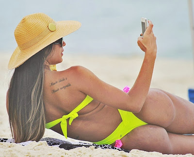 Lorena Bueri big butt in sexy string bikini on the beach photo