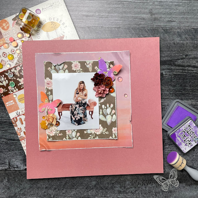 Newborn photography scrapbook layout made with: Prima Marketing Golden Desert patterned papers; Kaisercraft paper blooms flowers; T Holtz Distress Oxide Inks, Mini Detailed Butterfly die cuts