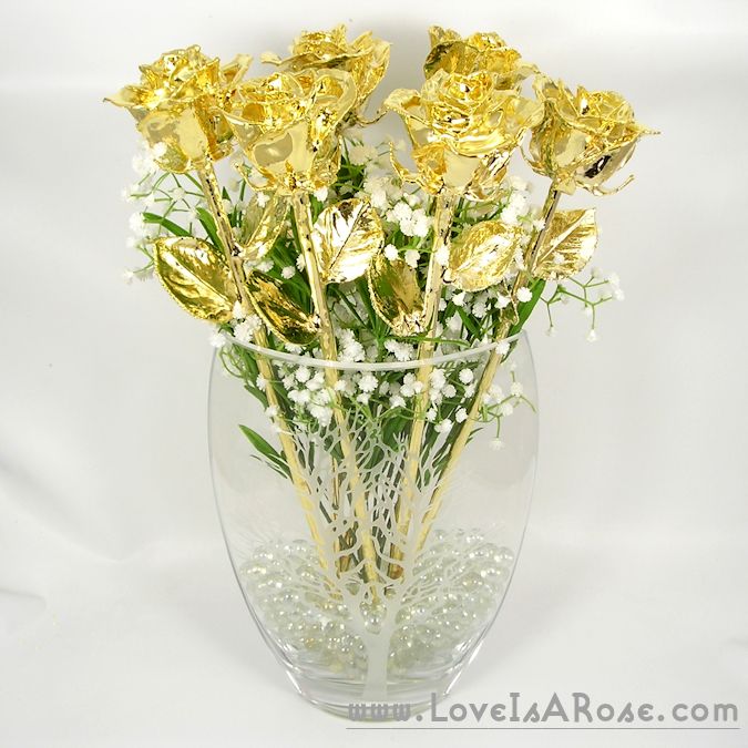comprising six natural 18' roses, dipped into 24karat gold, held in the crystal vase with a Tree of Life etched into the front.