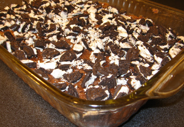 Chocolate Batter Topped with Crumbled Oreos Image