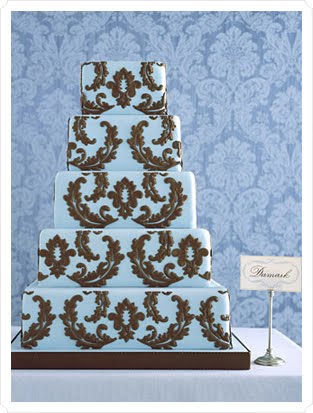 Gorgeous 6 tier round wedding cake in pale baby blue and white with delicate