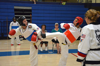 Two women sparring in adult martial art classes