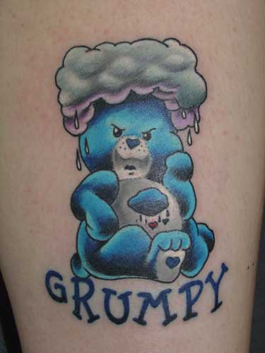 Care Bear tattoo with rainbow and clouds.