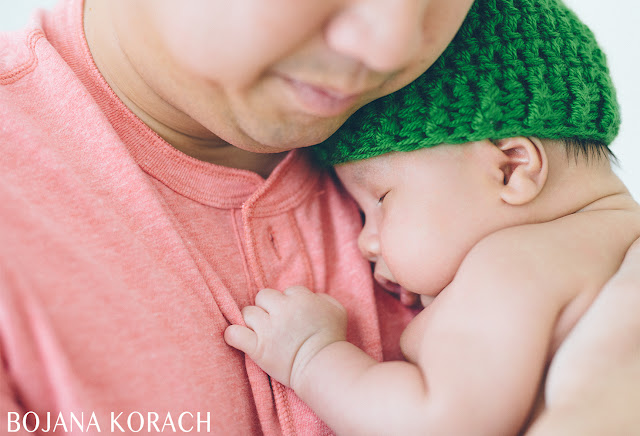 san francisco newborn baby sleeping on father's chest