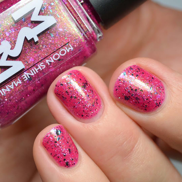 magenta nail polish with shimmer and flakies swatch