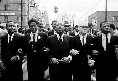 black and white photograph of Martin Luther King Marching for Voting Rights with John Lewis, Reverend Jesse Douglas, James Forman and Ralph Abernathy, Selma, 1965