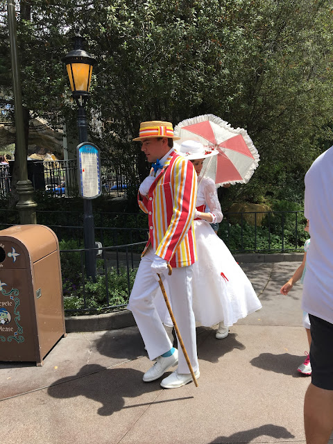 Bert and Mary Poppins Characters Walking In Fantasyland Disneyland