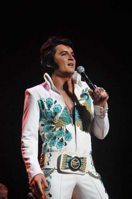 Ben porstmouth wearing peacock suit performing as Elvis impersonator