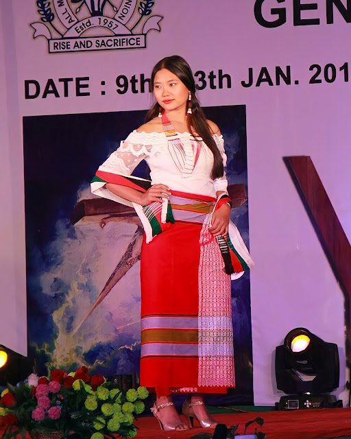 A Moyon model displaying her traditional dresses in a fashion show ramp