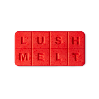 A rectangular chocolate bar shaped wax melt and bath melt with lush melt engraved into it on a bright background