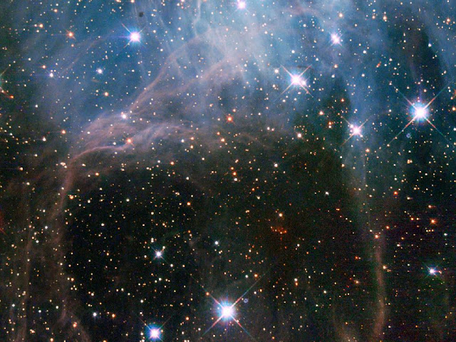 Imagens de do conglomerado de estrelas NGC 2040 ou LH 88 - localizado na Grande Nuvem de Magalhães