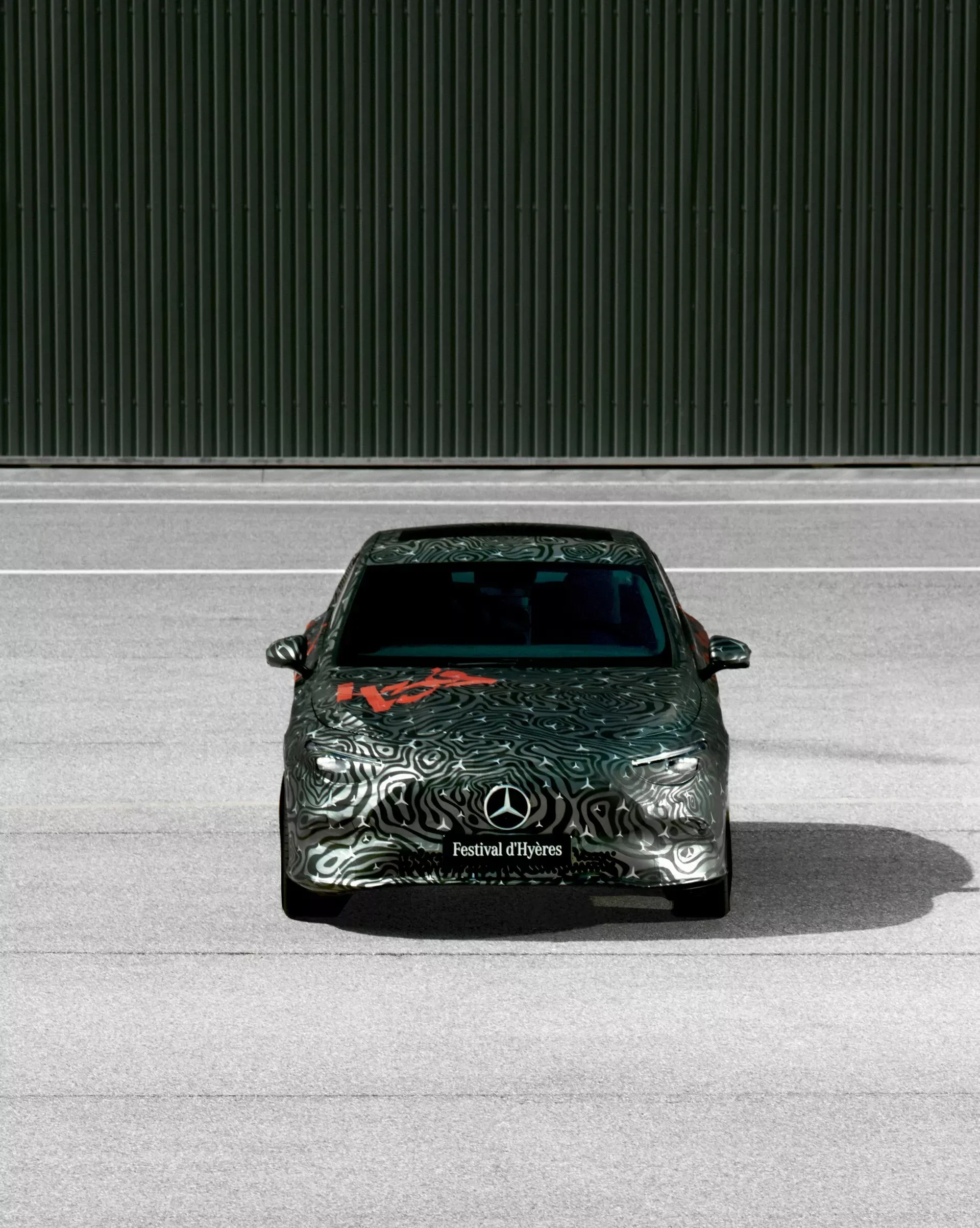 The highly anticipated 2026 Mercedes-Benz CLA has been teased in its closest-to-production form, showcasing a sleek design that blends the best of traditional internal combustion engines (ICE) and electric vehicles (EV). With inspiration drawn from a concept car unveiled last year, the new CLA promises to deliver cutting-edge technology and a bold aesthetic that stays true to its iconic roots.  Striking Design with Concept Car Influence The latest-generation CLA features a design closely inspired by the concept revealed 12 months ago. Mercedes-Benz has taken a more artistic approach in unveiling the vehicle, showcasing it with minimal camouflage at the 39th Festival d’Hyères in France. The grey and red exterior wrap was designed to catch the eye at this fashion-forward event, aligning with the stylish heritage of the CLA series.  At first glance, the 2026 CLA retains the sleek, compact profile that has defined previous generations. The front of the car has been significantly reworked with an updated grille, taking cues from last year’s concept model. Although the three-pointed star daytime running lights and a full-width LED light bar seem to be absent, the overall futuristic look remains, with sharp, aggressive headlight designs that are likely to evolve further in the production model.  Distinctive Body Lines and Rear-End Updates The exterior of the 2026 CLA is adorned with bold creases and dynamic design lines that add character to the model. These details extend from the front headlights to the rear, where they meet the CLA’s redesigned taillights. The circular LED signatures, reminiscent of the concept, give the rear a futuristic flair, while a subtle lip spoiler on the trunk adds a sporty touch.  As with its predecessors, the CLA’s flowing bodywork balances aerodynamics and aesthetics, contributing to its performance while maintaining a stylish edge. The pronounced shoulder line is a standout feature, linking the front and rear of the car in a cohesive design that emphasizes strength and elegance.  A Versatile Powertrain: ICE, Hybrid, and EV Options The 2026 CLA will be built on Mercedes-Benz’s adaptable MMA platform, designed to accommodate both combustion engines and electric powertrains. The ICE versions are expected to be powered by four-cylinder engines with hybrid assistance, ensuring improved efficiency and reduced emissions.  For those looking toward the future of driving, the EV version of the CLA is set to impress with its advanced 800-volt architecture, allowing for rapid charging speeds of up to 250 kW. The electric CLA will also include bidirectional charging capabilities, supporting Vehicle-to-Home (V2H) and Vehicle-to-Grid (V2G) technologies, making it a versatile option for environmentally conscious drivers. Mercedes is also working on a high-performance AMG version of the electric CLA, potentially packing over 500 horsepower for those who crave a more thrilling driving experience.  Launch and Market Availability Mercedes-Benz is expected to fully unveil the 2026 CLA in the coming months, with the vehicle set to hit the market as a 2026 model. It will be available in the United States and other key global markets, appealing to drivers looking for a luxury vehicle that merges traditional combustion engines with the latest electric technologies. With its refined design and versatile powertrain options, the CLA is poised to be a significant player in the next wave of luxury vehicles.
