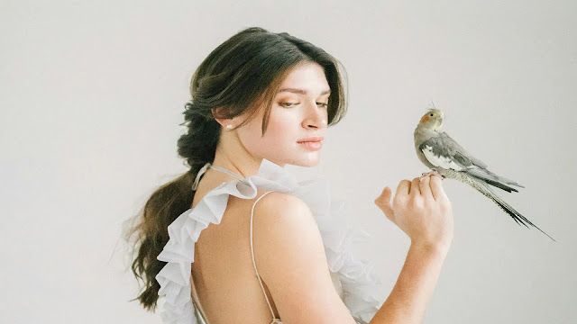 Girl holding a bird