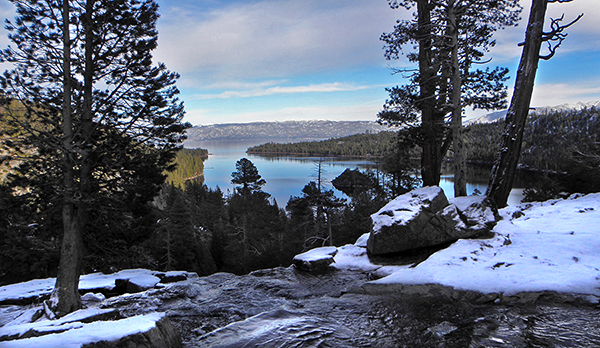 Eagle creek in foreground above waterfall, Emerald bay and mountains in background