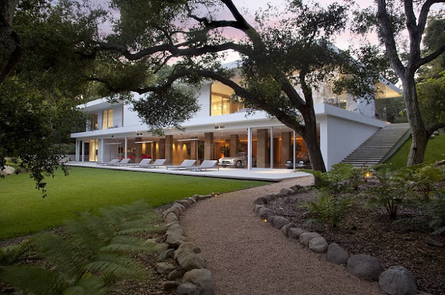 Vintage car collector's Glass Pavilion |  Steve Hermann  the ultimate Vintage car collector's crash pad in Montecito, California, a modernist masterpiece designed to house a world-class collection of 35 Vintage cars. that's $1 million per car  in a stunning automotive art gallery.