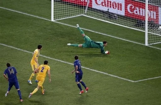 France player Jérémy Ménez scores the opening goal past Ukraine goalkeeper Andriy Pyatov