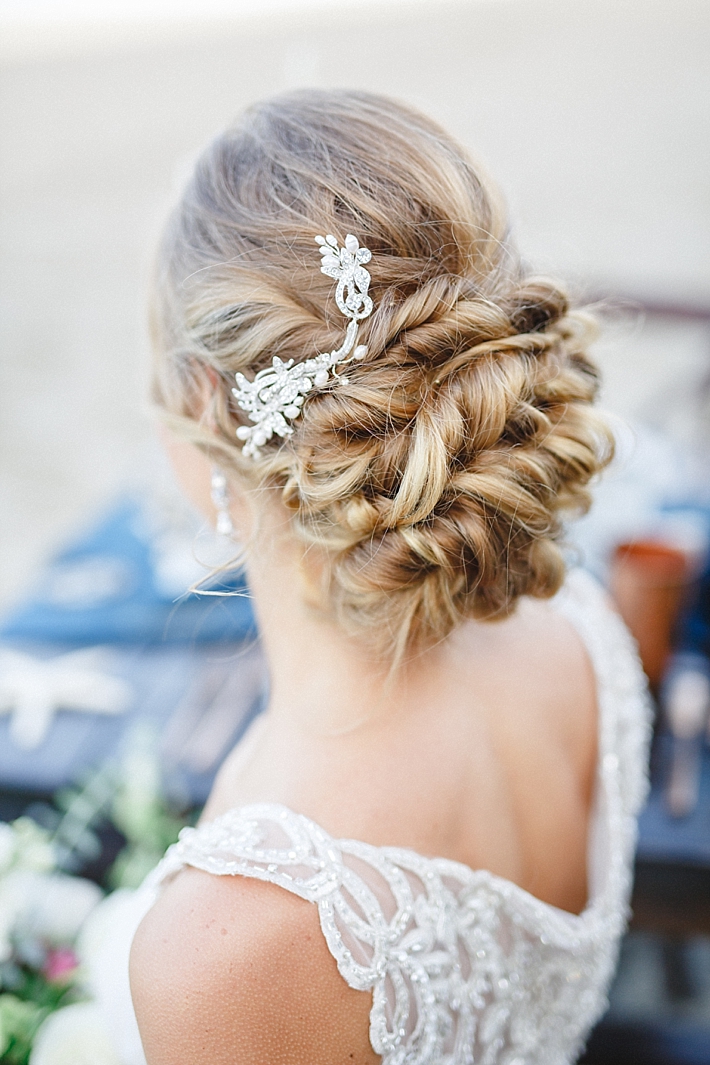 Elegant Bridal Updo with jewel-encrusted hairpiece | Photo: Damaris Mia Photography