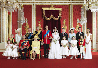 The extended wedding party gather for this magnificent shot in Buckingham Palace.