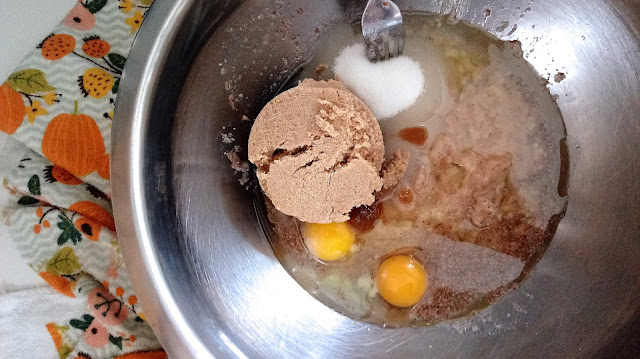 wet ingredients for Caramelized Banana Bread sitting in a stainless steel bowl