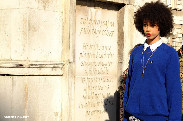 Pippa Christian at lfw wearing a blue jumper and red lips