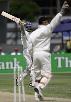 Kumar Sangakkara celebrates his hundred even as Brendon McCullum appeals for a run-out against Muttiah Muralitharan, New Zealand v Sri Lanka, 1st Test, Christchurch, 3rd day, December 9, 2006