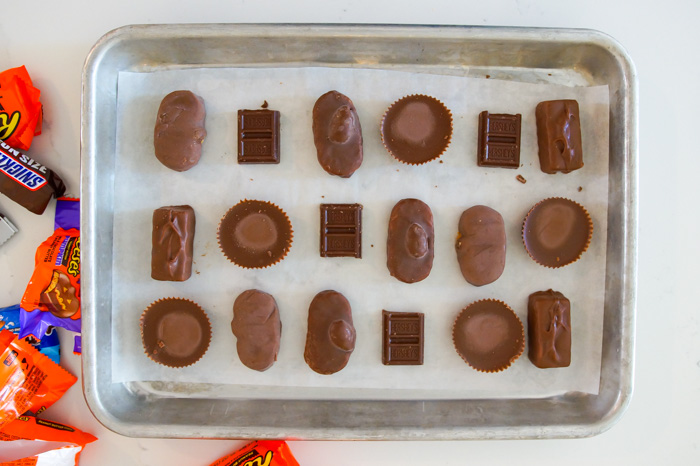 mini candy bars unwrapped on cookie sheet