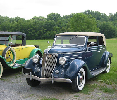  of cars from different time periods My favorite was this old blue Ford