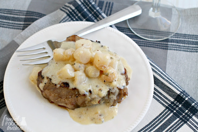 Juicy tenderloin steaks are marinated in a flavorful coffee marinade and then topped with a simple yet elegant scallop tarragon cream sauce.