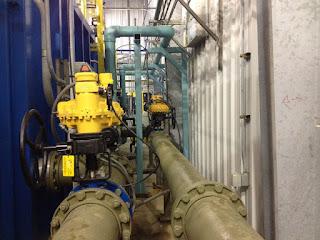 Kinetrol pneumatic actuators installed on pipeline.