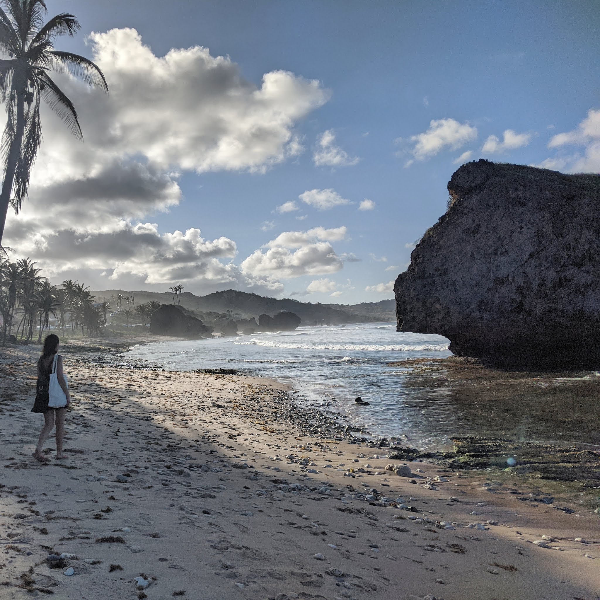 Lydia Swinscoe walks past huge coral boulders on the beach in Bathsheba, one of the most incredible beaches in Barbados