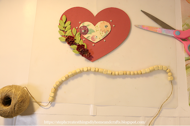 Wooden heart, and  beaded twine